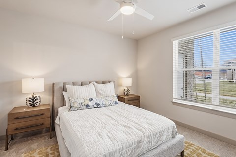 Bedroom with upholstered bed and ceiling fan at Viridian Apartments, Kentucky, 42104