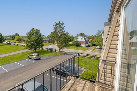 the view from the balcony of an apartment building with cars parked on the street at Tates Creek Crossings, Kentucky