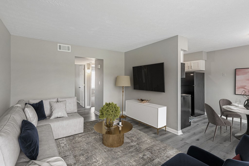 a living room with gray walls and a white couch