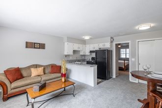 a living room with a couch and a table