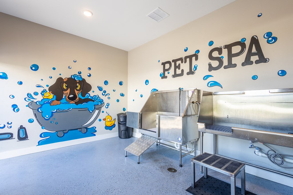 a pet spa with a dog in a tub and a wall mural of a dog at Arlington Farms, Greenwood