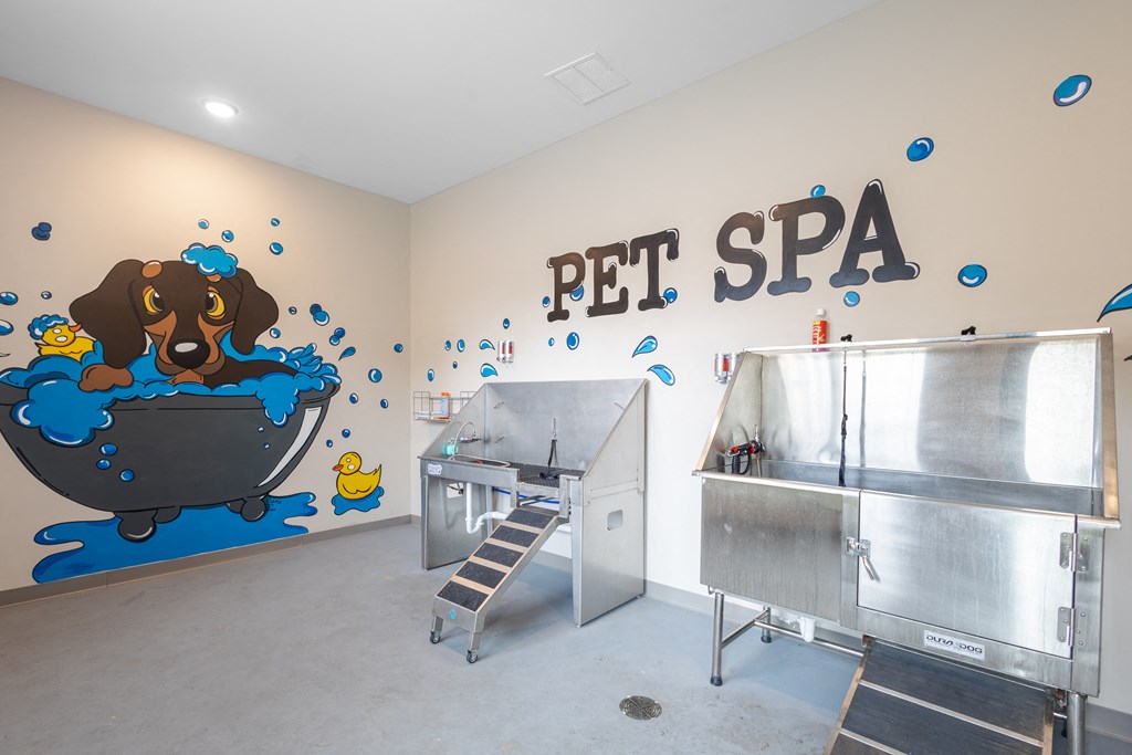 a pet spa with a dog in a tub and a wall with a wall mural at Sage Springs, Elizabethtown, KY