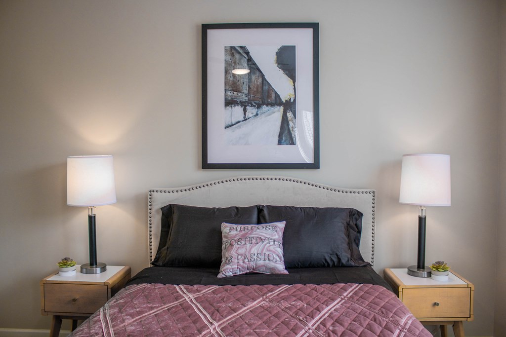 a bedroom with a bed and two lamps and a picture on the wall at Sage Springs, Kentucky