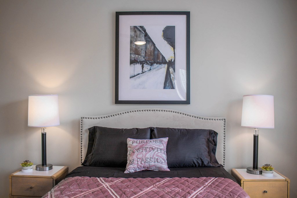 a bedroom with a bed and two lamps and a picture on the wall at Arlington Farms, Indiana, 46143
