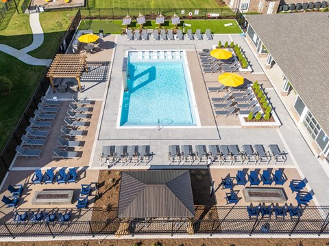 Aerial view of pool deck with fire pits and lounge chairs at Viridian Apartments, Bowling Green, KY 42104
