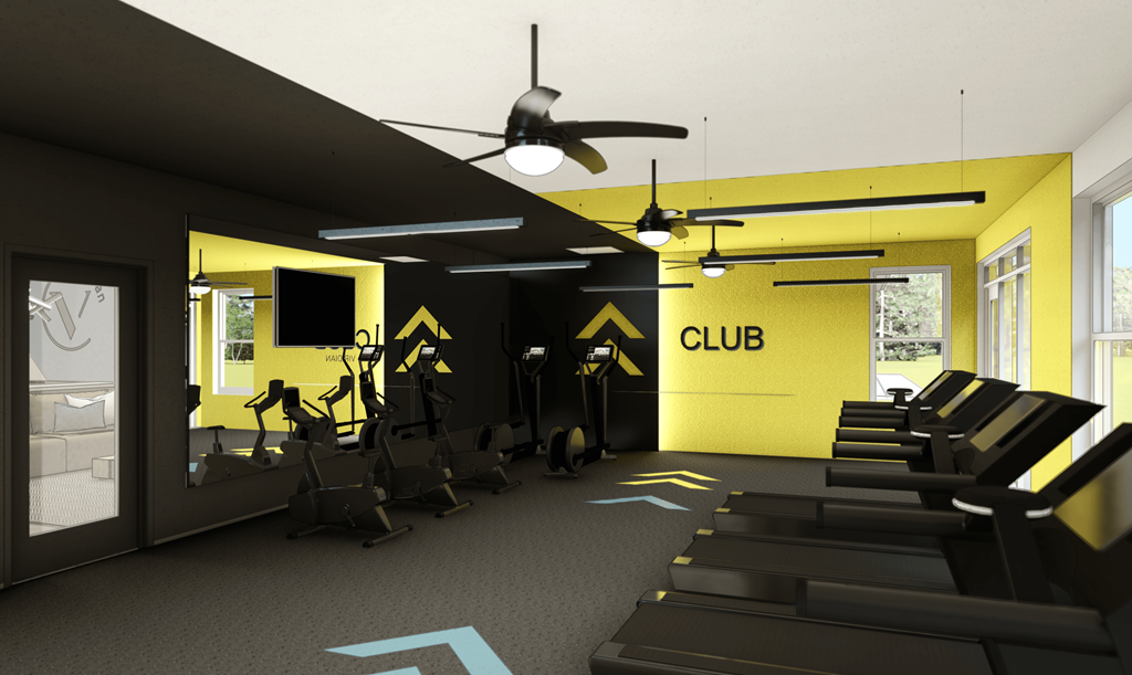 a gym with treadmills and a wall with a club logo