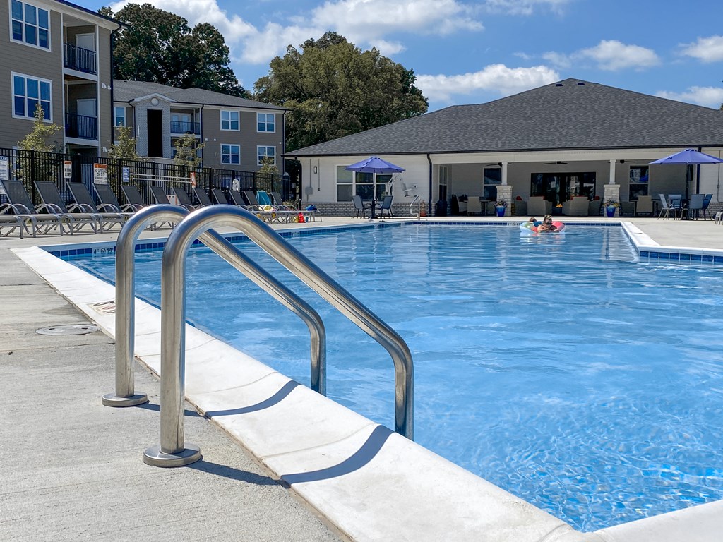 a swimming pool with a building in the background at Sage Springs, Elizabethtown, 42710