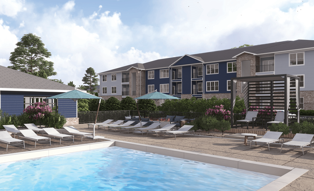 an outdoor pool with chairs and umbrellas in front of an apartment building