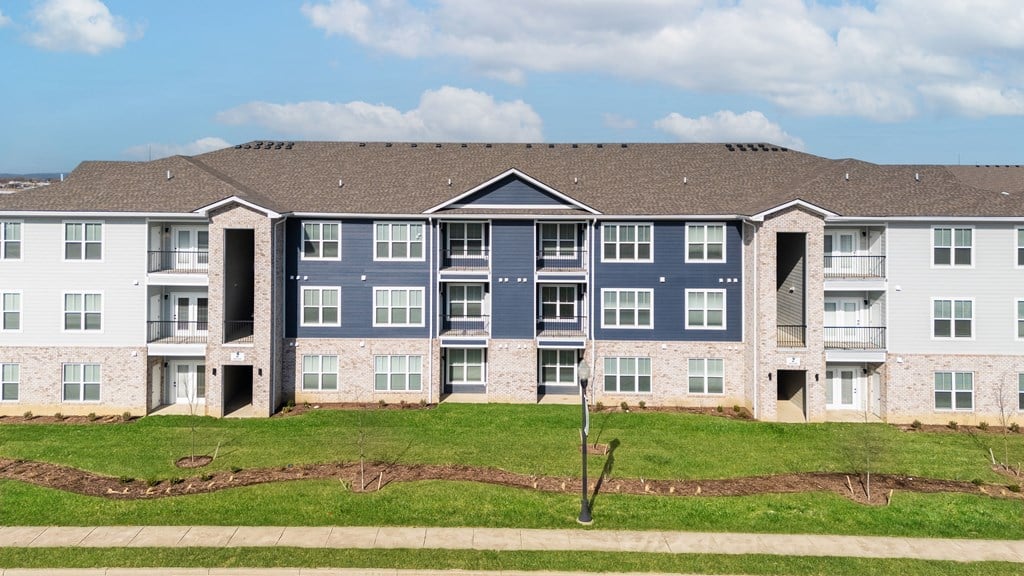 A large apartment complex with multiple buildings and balconies at The Warren Apartments, Indiana, 47130