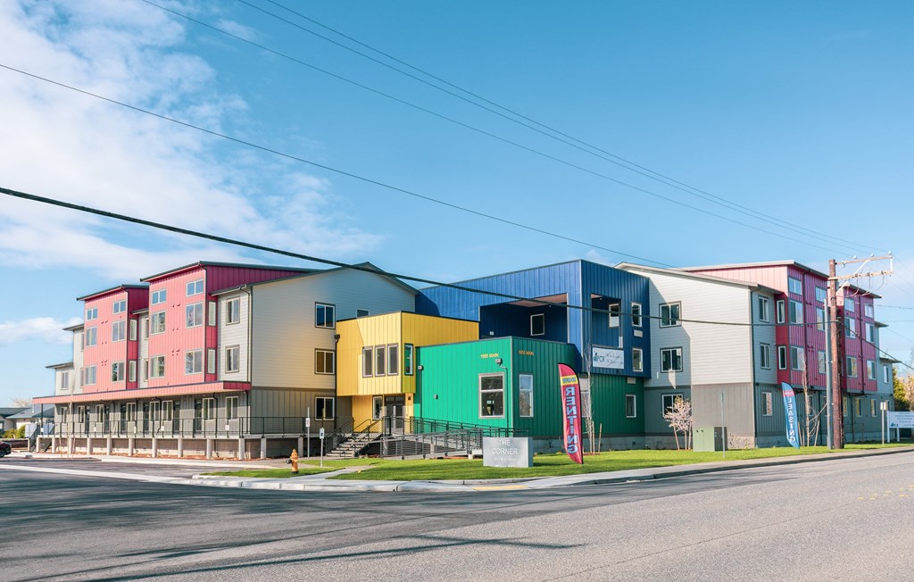 a row of colorful houses on the side of a street