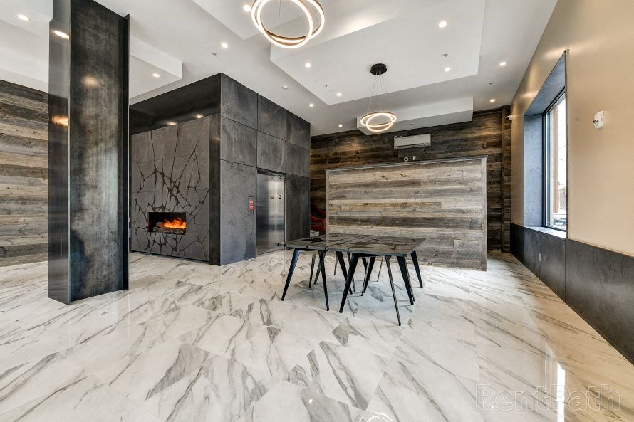 a dining room with a table and chairs and a fireplace