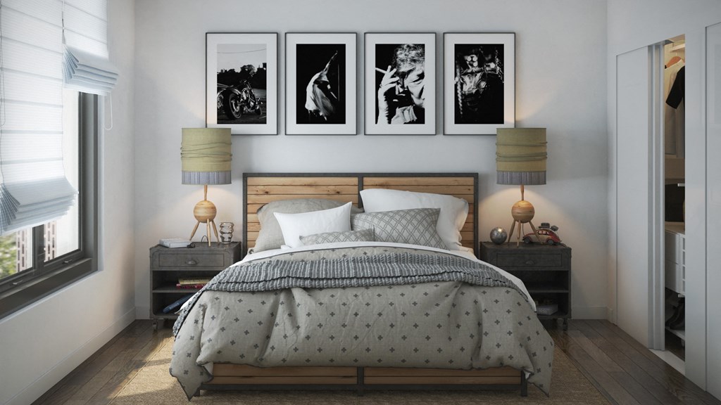 a bedroom with a bed and pictures on the wall