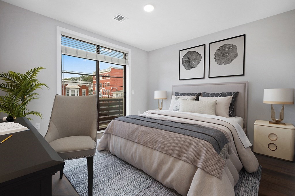 a bedroom with a bed and a window