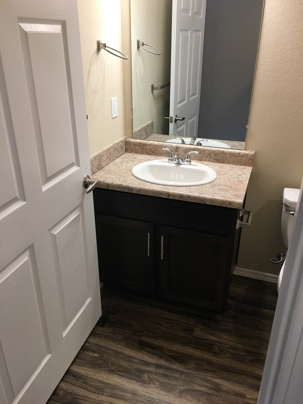 a small bathroom with a sink and a mirror