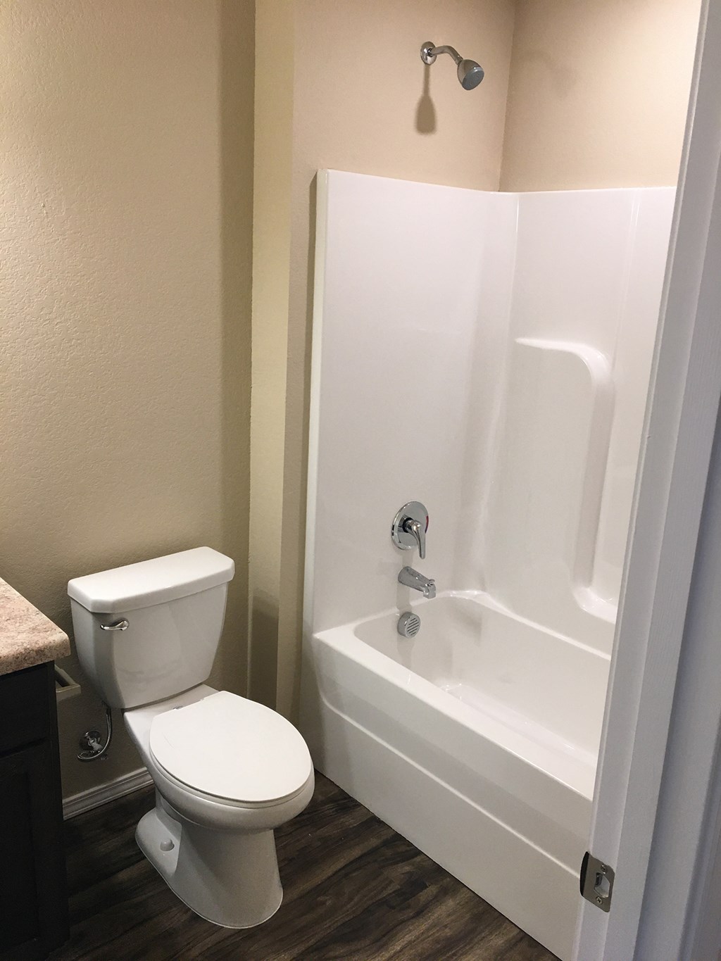 a small bathroom with a toilet and a tub