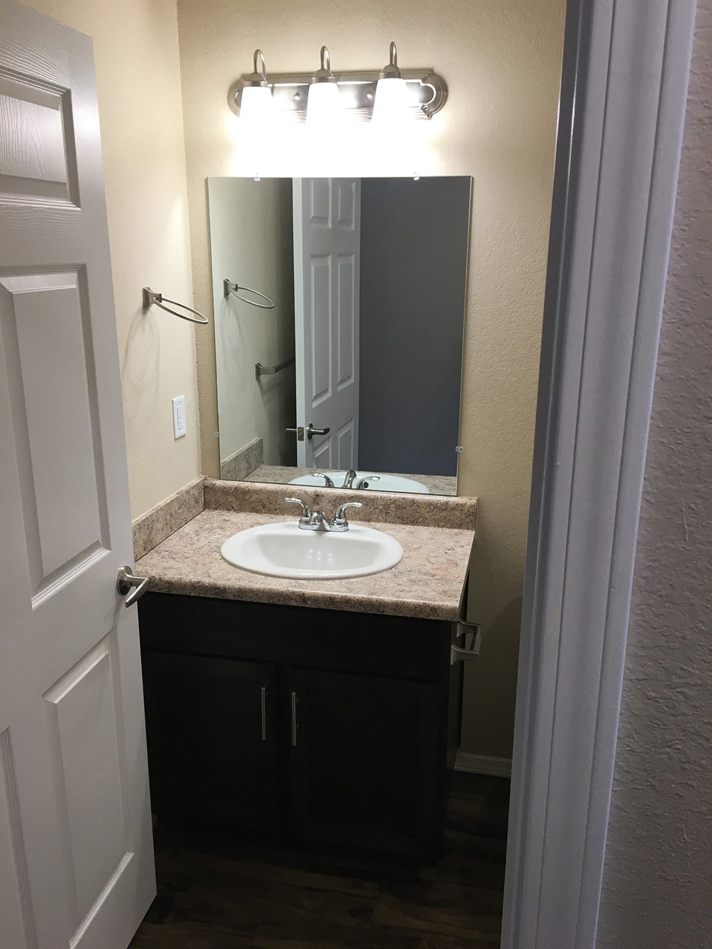 a small bathroom with a sink and a mirror