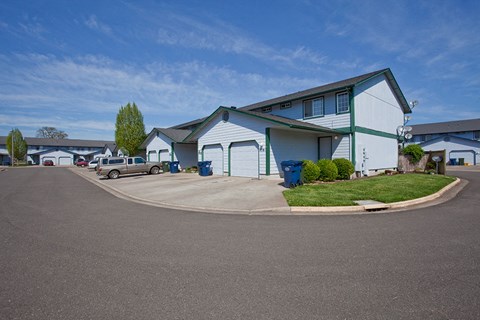 a house with a driveway and a street in front of it