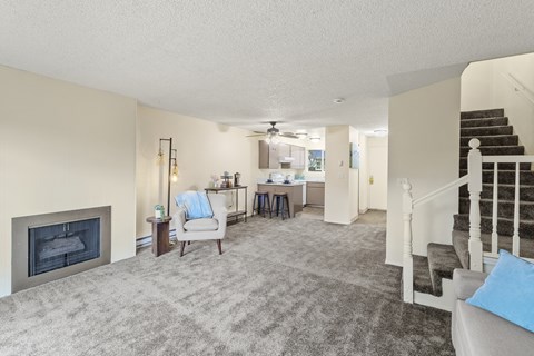 A living room with a fireplace and a couch.