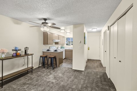 A well-lit, clean, and organized kitchen and dining area in a home.