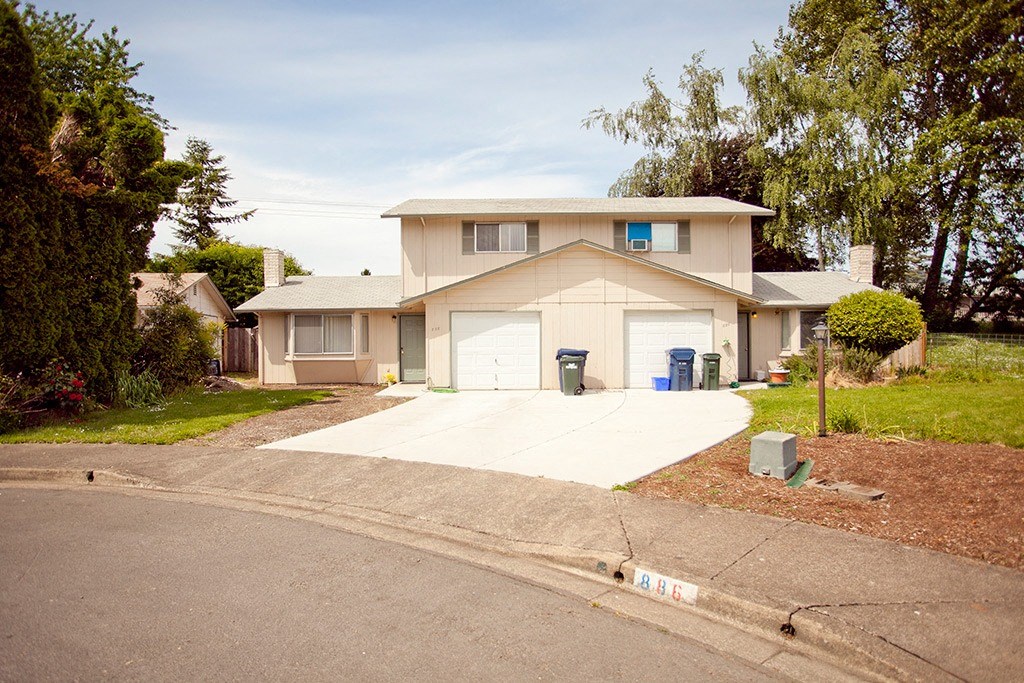 a house with a driveway and a garage door