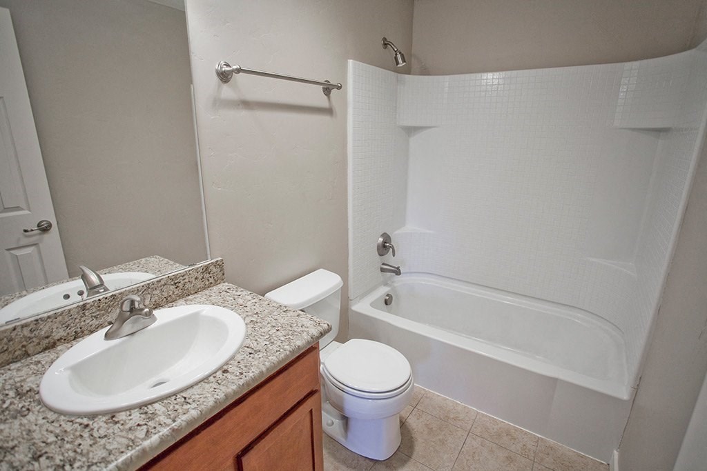 a bathroom with a sink toilet and a shower