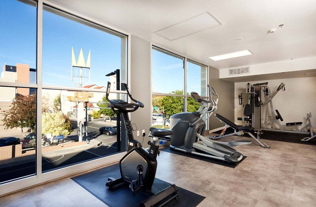 a gym with a view of the city