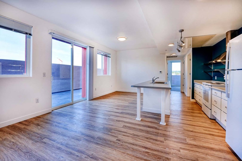 a kitchen with an island and a door to the beach