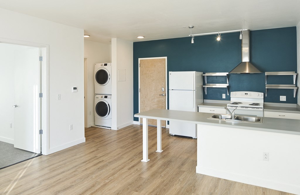 a kitchen and laundry room with a washer and dryer