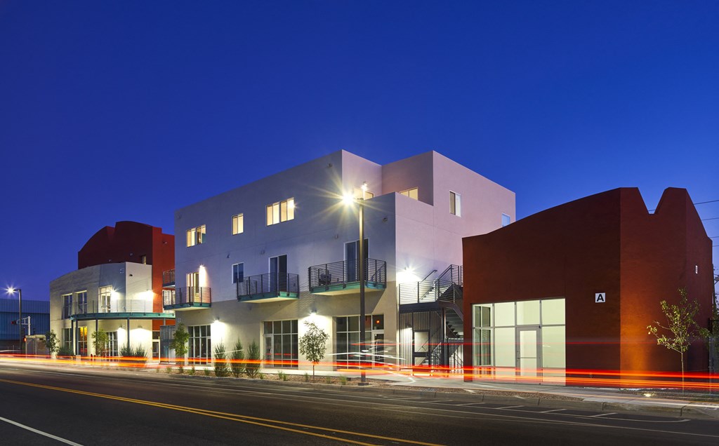 a view of a building from the street at night