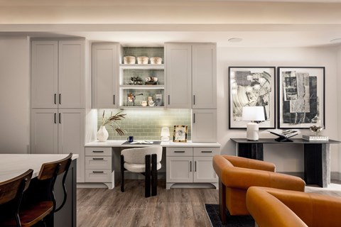 A modern kitchen with a dining table and chairs.