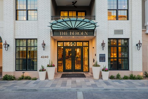 The Bergen hotel entrance is framed by two large planters.