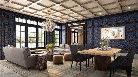 A living room with a grey sofa, a wooden table, and a chandelier.