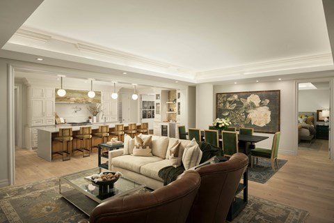 A living room with a brown leather chair in the foreground.