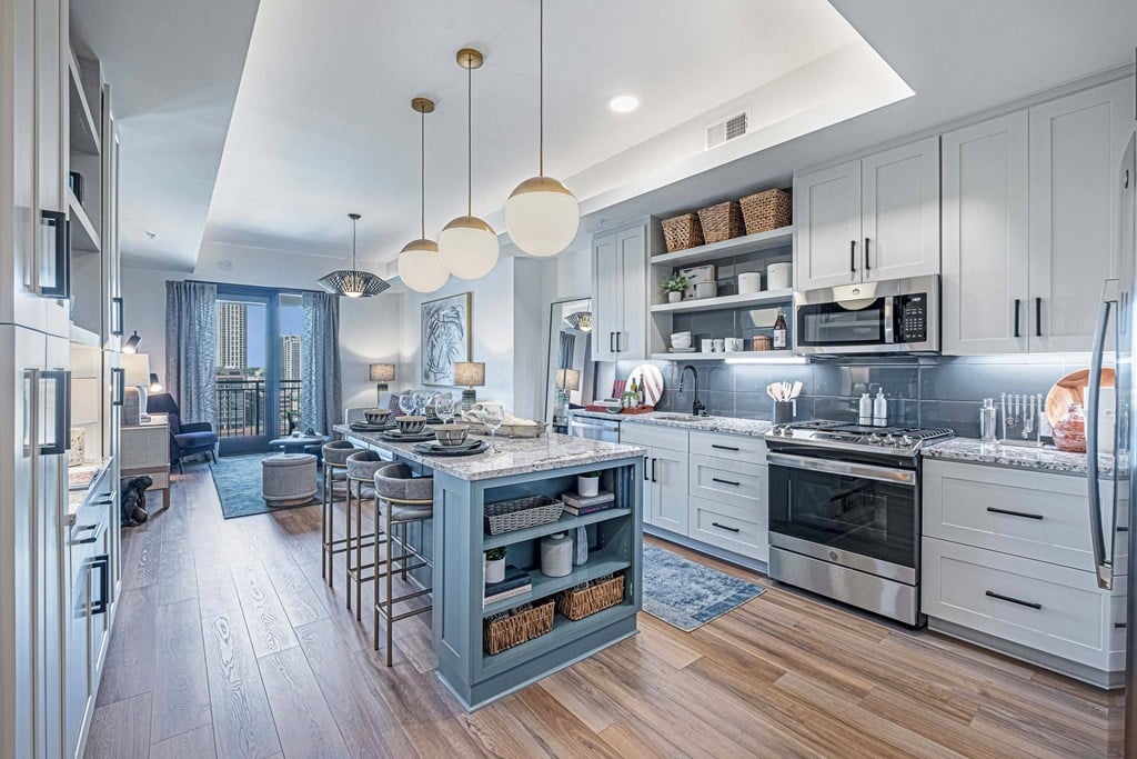 a kitchen with a large island in the middle of it