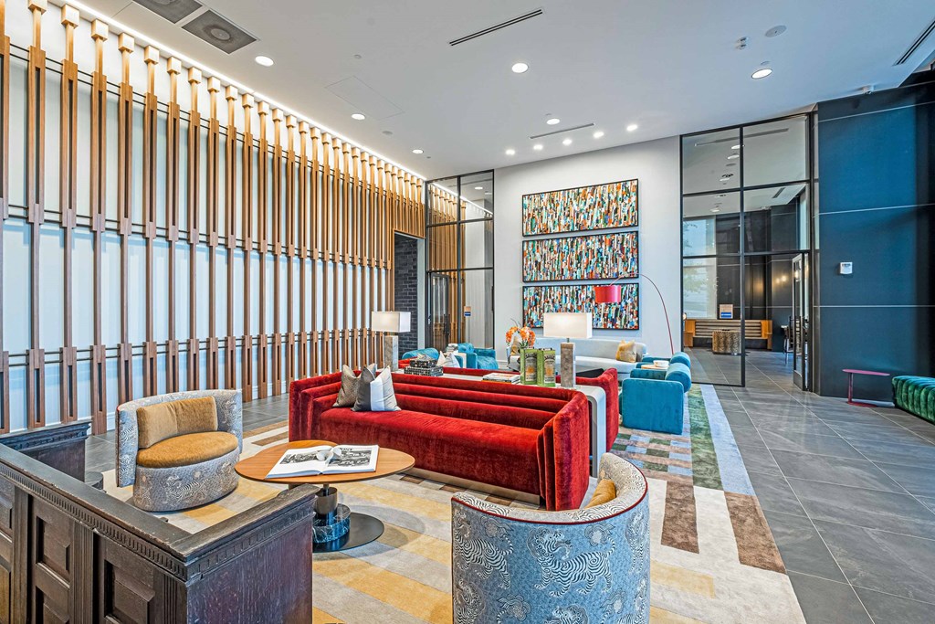 a lobby with couches and chairs and a table