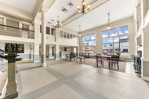 A large open space with tables and chairs and a balcony at 206 Flats Apartments, Spokane, WA, 99201