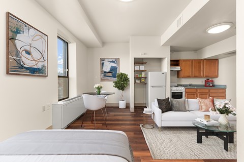 A modern living room with a grey sofa and a coffee table.