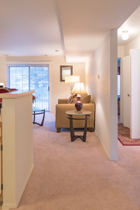 a living room with a couch and a table