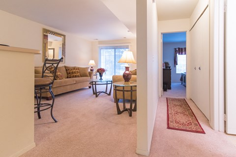 a living room and dining room with a couch and a table