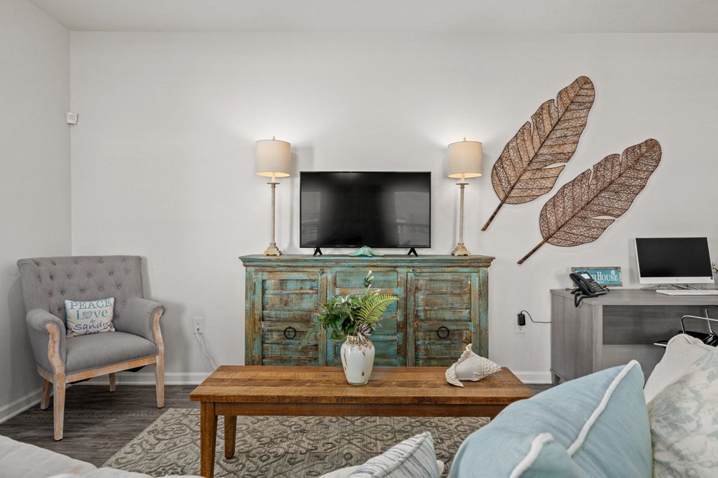 a living room with a couch and a tv and a table