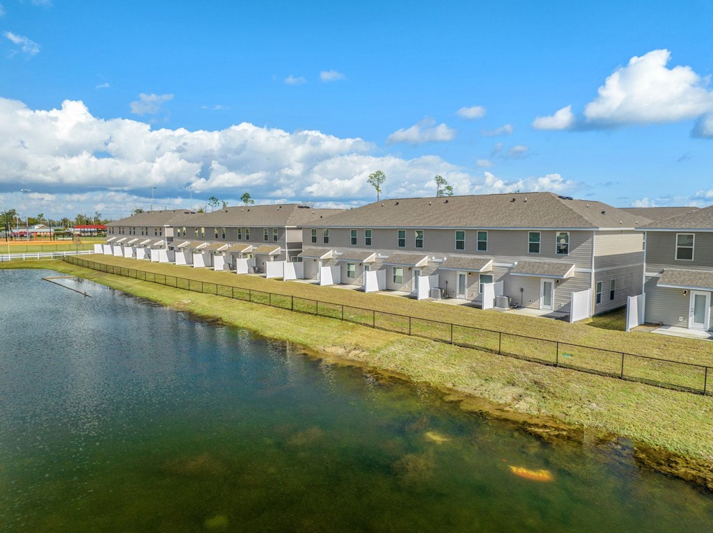 a row of apartments overlooking a body of water