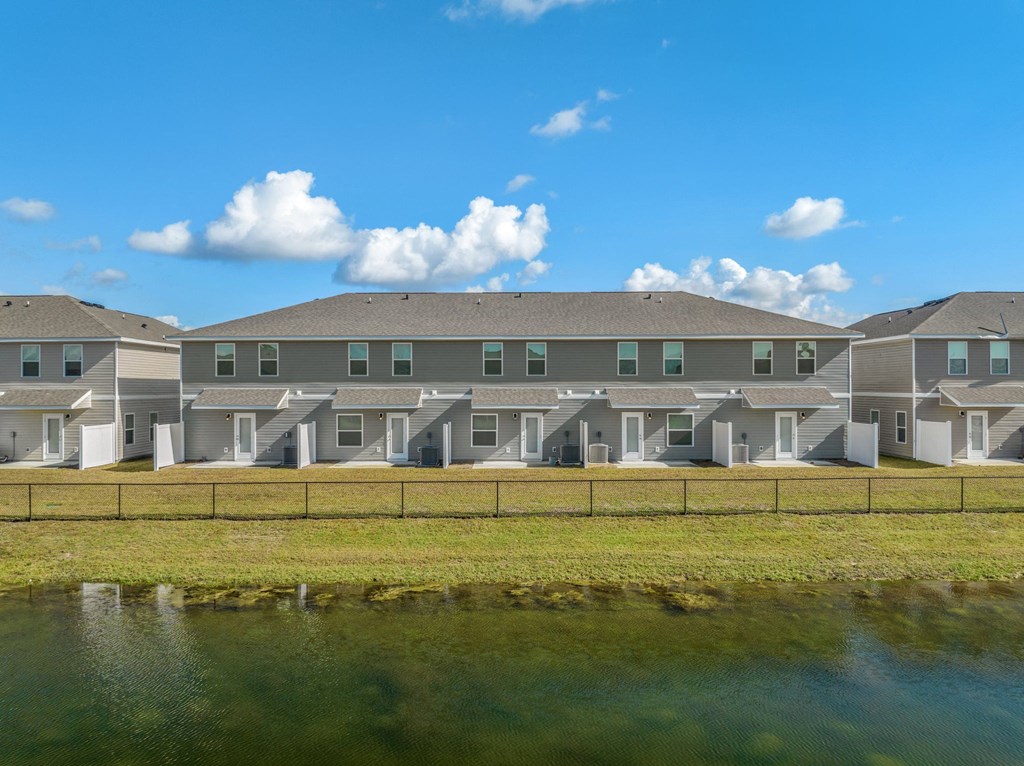 an apartment building overlooking a body of water
