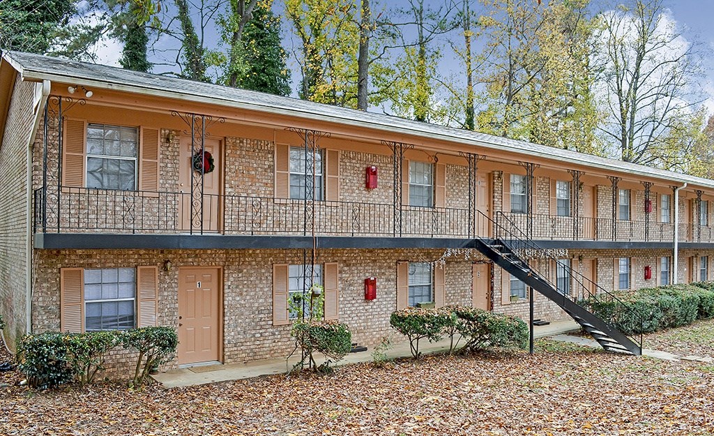 A building with a balcony and a staircase.