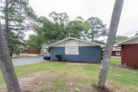 A small building with a sign that says "JACKSON" on it.