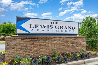 a sign for the lewis grand apartments