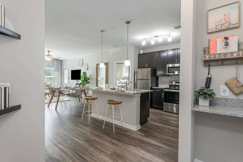 a kitchen and dining area in a 555 waverly unit
