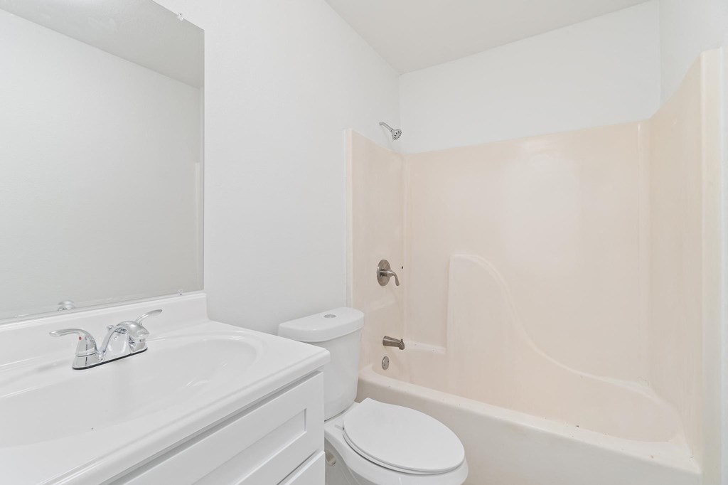 a bathroom with a sink toilet and bathtub