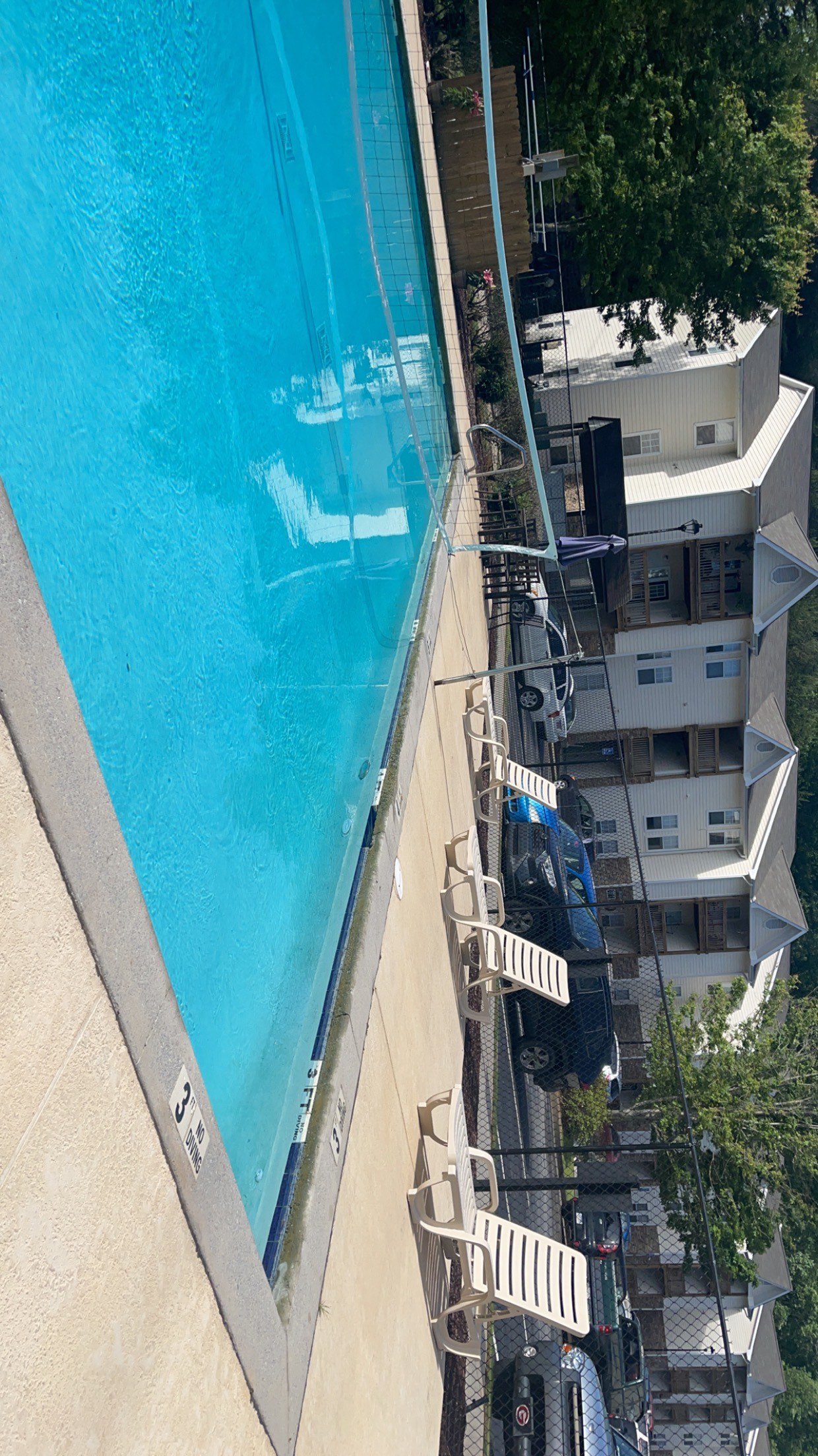 an aerial view of a swimming pool on the top of a building