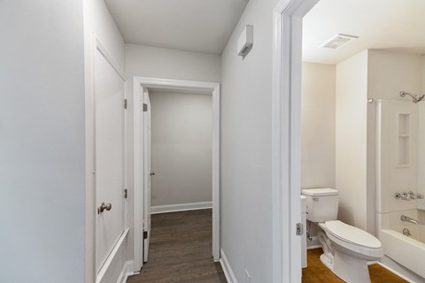 an empty bathroom with a toilet and a shower