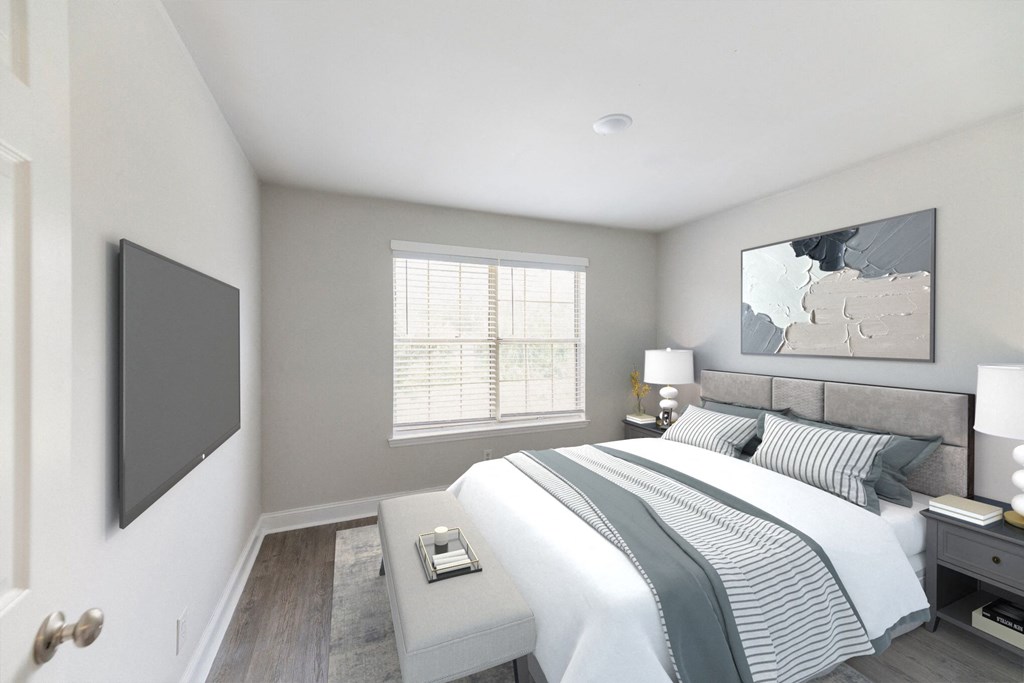 an image of a bedroom with a bed and a tv